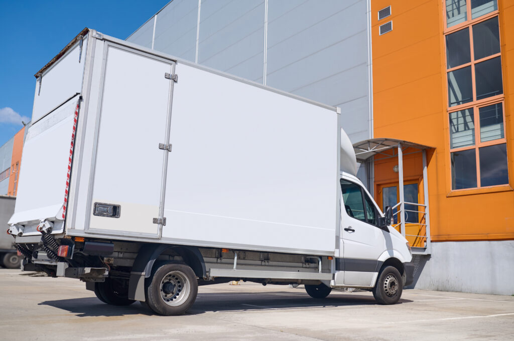 lorry standing outdoors near the warehouse